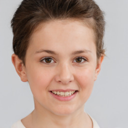 Joyful white child female with short  brown hair and brown eyes