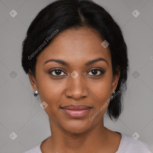 Joyful black young-adult female with short  black hair and brown eyes