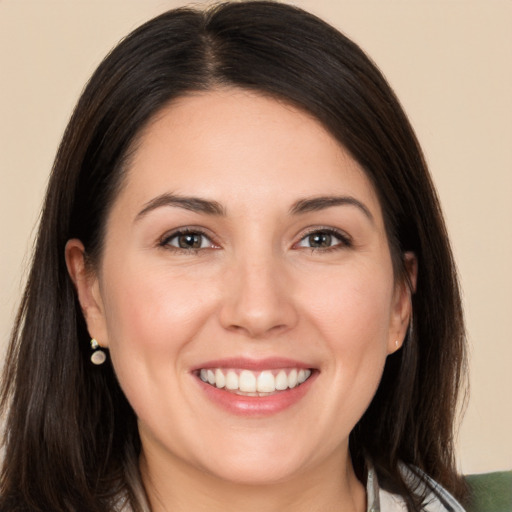 Joyful white young-adult female with medium  brown hair and brown eyes