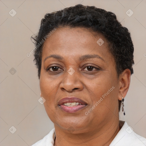 Joyful black adult female with short  brown hair and brown eyes