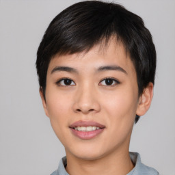 Joyful asian young-adult female with short  black hair and brown eyes