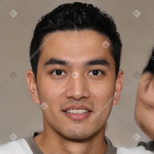 Joyful latino young-adult male with short  black hair and brown eyes