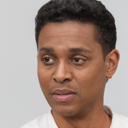 Neutral latino adult male with short  black hair and brown eyes