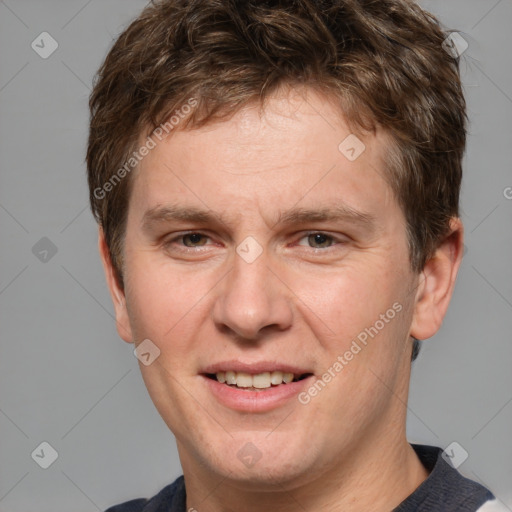 Joyful white adult male with short  brown hair and grey eyes