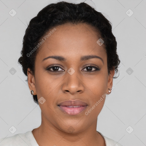 Joyful black young-adult female with short  black hair and brown eyes