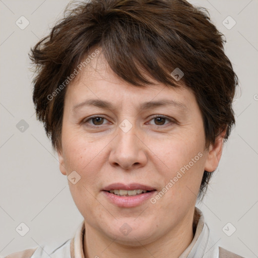 Joyful white adult female with short  brown hair and brown eyes