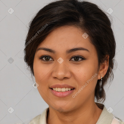 Joyful latino young-adult female with medium  brown hair and brown eyes