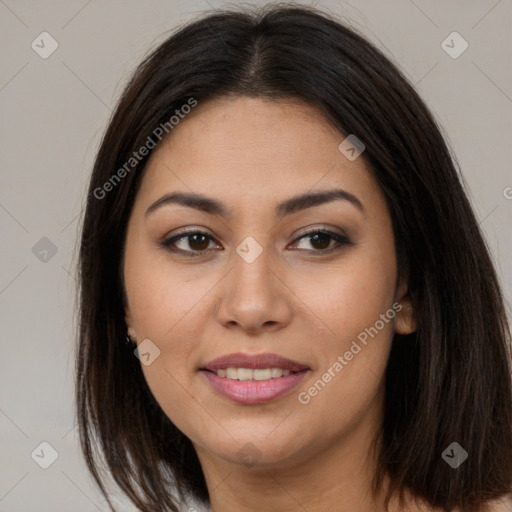 Joyful latino young-adult female with long  brown hair and brown eyes