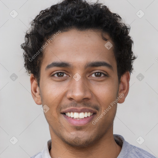 Joyful latino young-adult male with short  brown hair and brown eyes