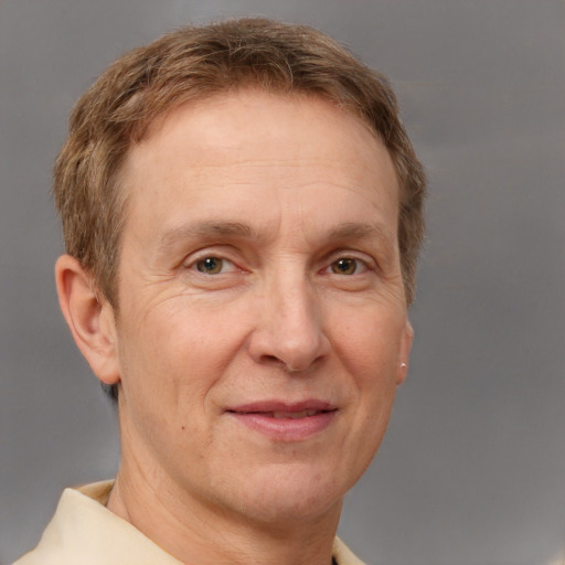 Joyful white middle-aged male with short  brown hair and brown eyes