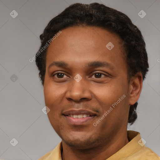 Joyful latino young-adult male with short  brown hair and brown eyes