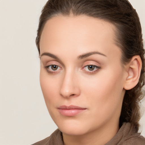 Neutral white young-adult female with long  brown hair and brown eyes