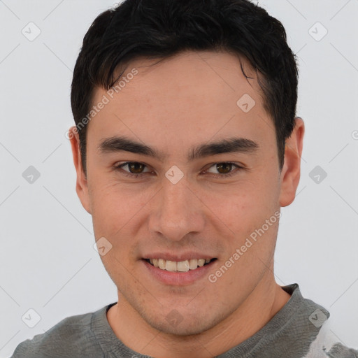 Joyful asian young-adult male with short  brown hair and brown eyes