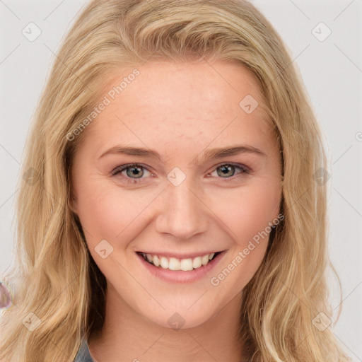 Joyful white young-adult female with long  brown hair and blue eyes