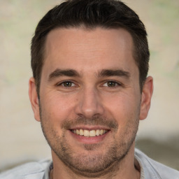 Joyful white adult male with short  brown hair and brown eyes