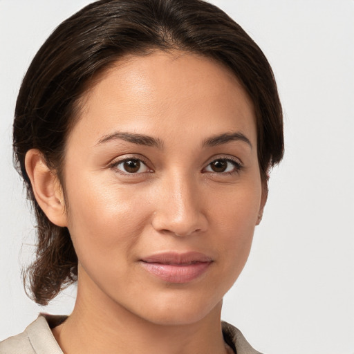 Joyful white young-adult female with medium  brown hair and brown eyes