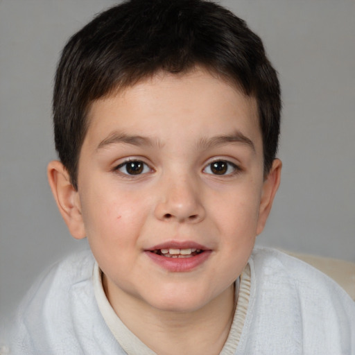 Joyful white child male with short  brown hair and brown eyes