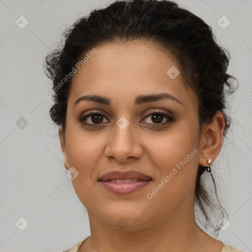 Joyful latino young-adult female with short  brown hair and brown eyes