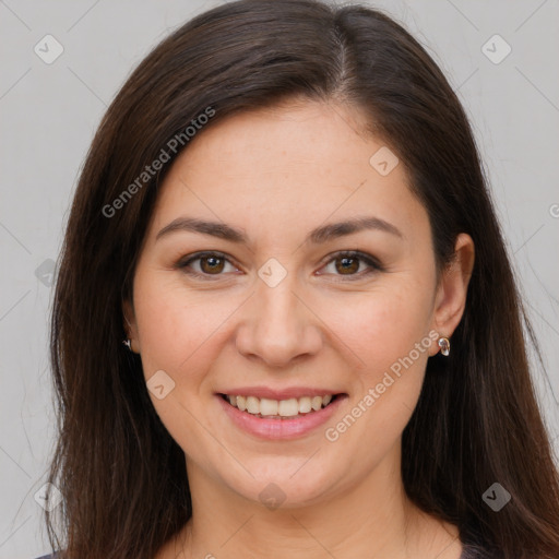 Joyful white young-adult female with long  brown hair and brown eyes