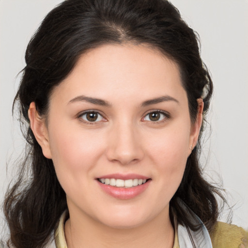 Joyful white young-adult female with medium  brown hair and brown eyes