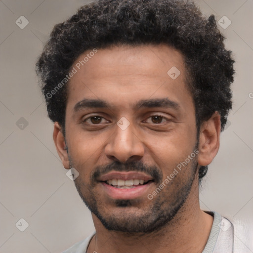 Joyful white young-adult male with short  black hair and brown eyes