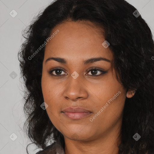 Joyful black young-adult female with long  black hair and brown eyes