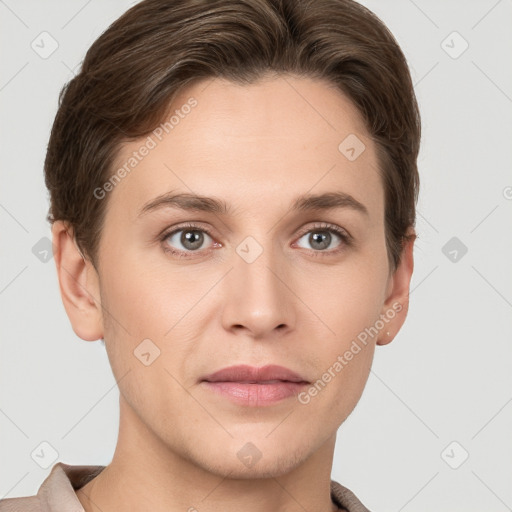 Joyful white young-adult female with short  brown hair and grey eyes