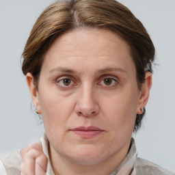 Joyful white adult female with short  brown hair and brown eyes