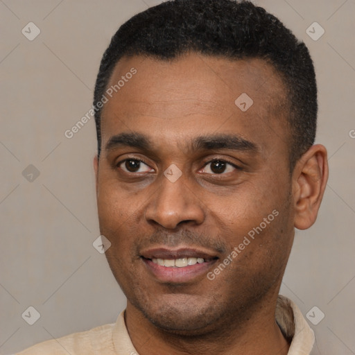 Joyful latino young-adult male with short  black hair and brown eyes