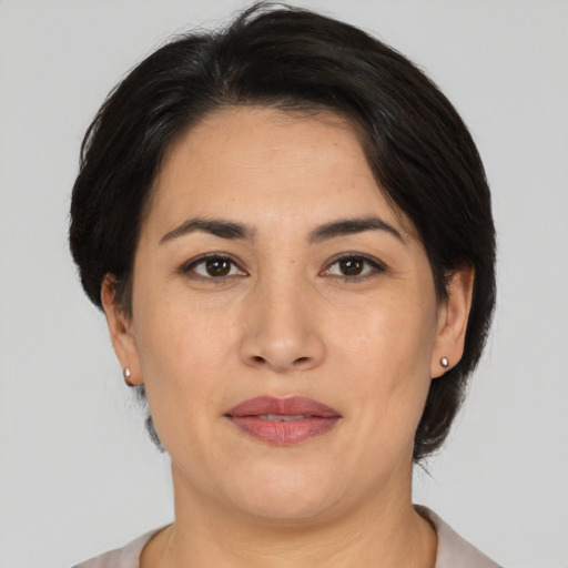 Joyful white adult female with short  brown hair and brown eyes