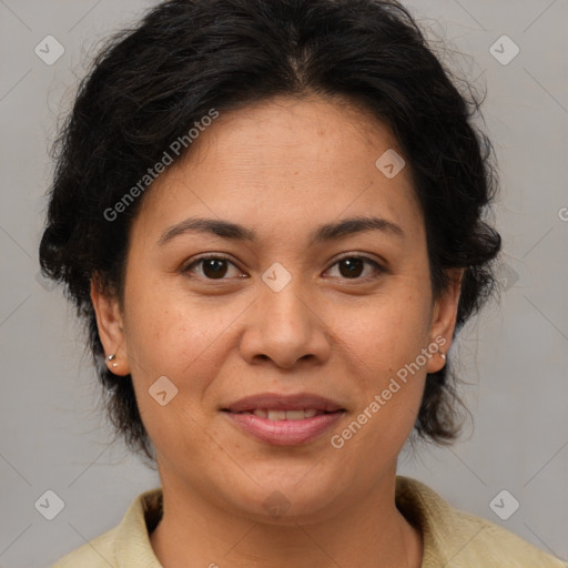 Joyful latino adult female with medium  brown hair and brown eyes