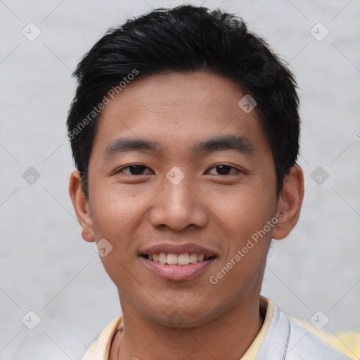 Joyful asian young-adult male with short  black hair and brown eyes