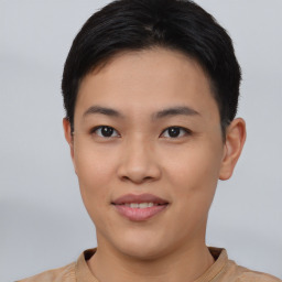 Joyful asian young-adult female with short  black hair and brown eyes