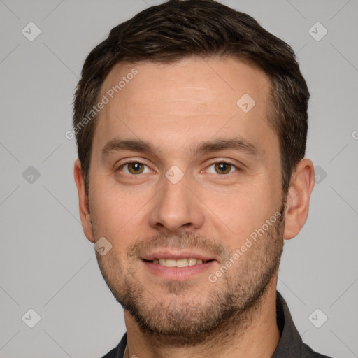 Joyful white young-adult male with short  brown hair and grey eyes