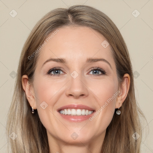 Joyful white adult female with long  brown hair and grey eyes