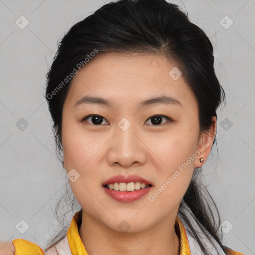 Joyful asian young-adult female with medium  brown hair and brown eyes