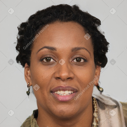 Joyful black adult female with short  brown hair and brown eyes