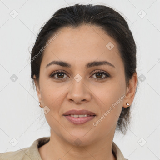 Joyful latino young-adult female with medium  brown hair and brown eyes