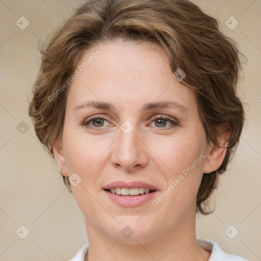 Joyful white young-adult female with medium  brown hair and green eyes