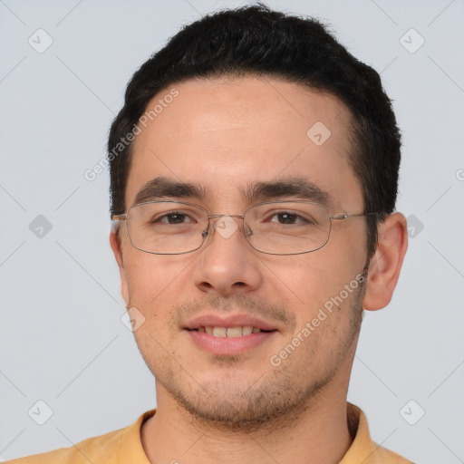 Joyful white young-adult male with short  black hair and brown eyes