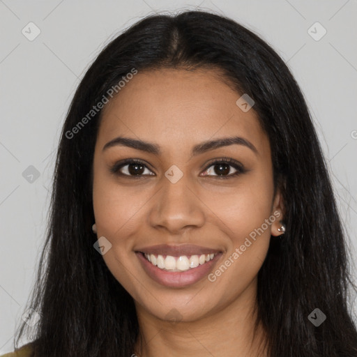 Joyful latino young-adult female with long  brown hair and brown eyes