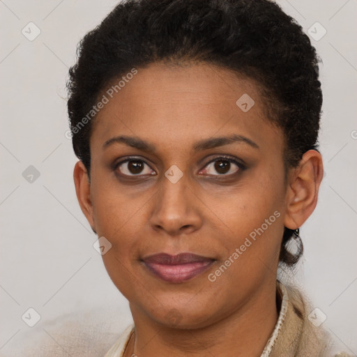 Joyful black young-adult female with short  brown hair and brown eyes