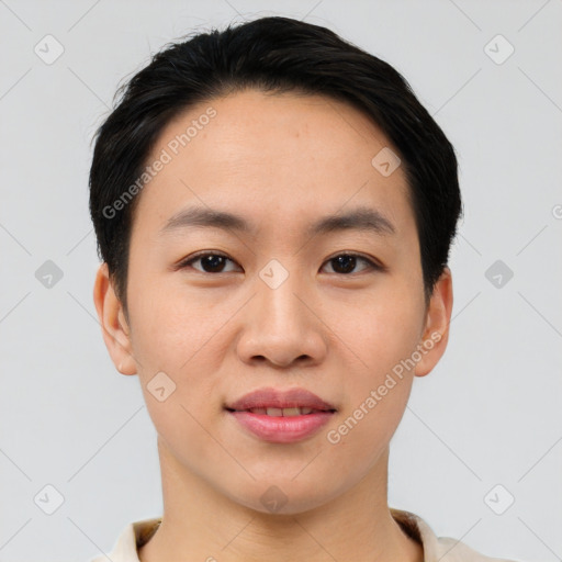 Joyful asian young-adult male with short  brown hair and brown eyes