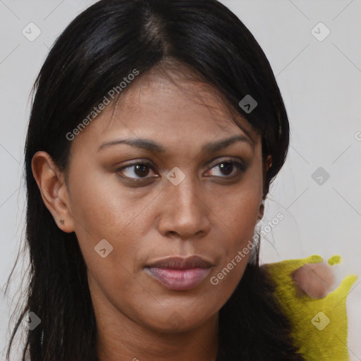 Joyful black young-adult female with long  brown hair and brown eyes