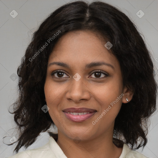 Joyful black young-adult female with medium  brown hair and brown eyes