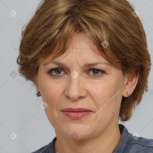 Joyful white adult female with medium  brown hair and blue eyes