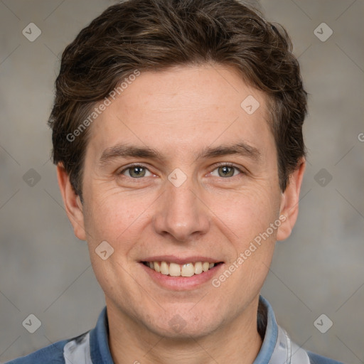 Joyful white adult male with short  brown hair and grey eyes