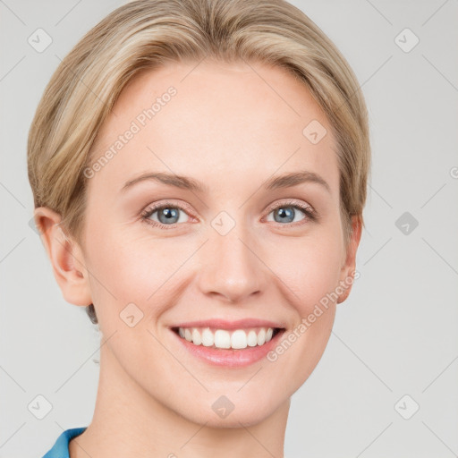 Joyful white young-adult female with short  brown hair and grey eyes