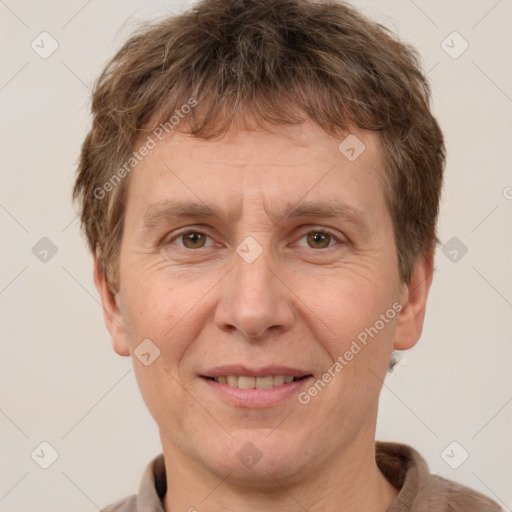 Joyful white adult male with short  brown hair and grey eyes