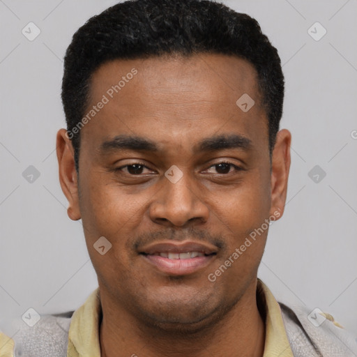 Joyful black young-adult male with short  black hair and brown eyes